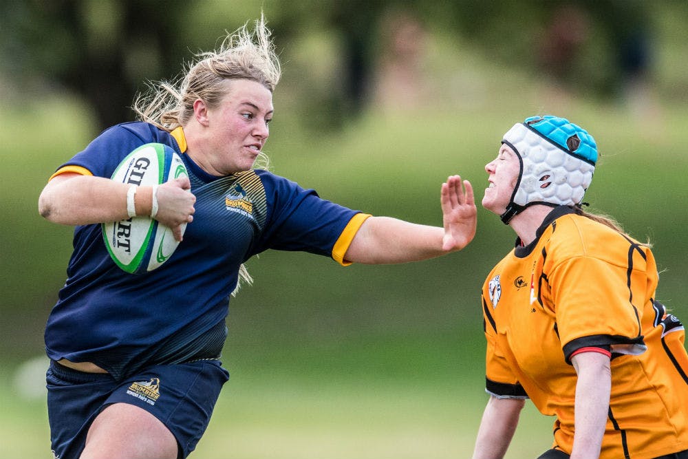 ACT's Tayla Stanford hands off Issabell Hunt of NSW Country. Photo: ARU Media/Stu Walmsley