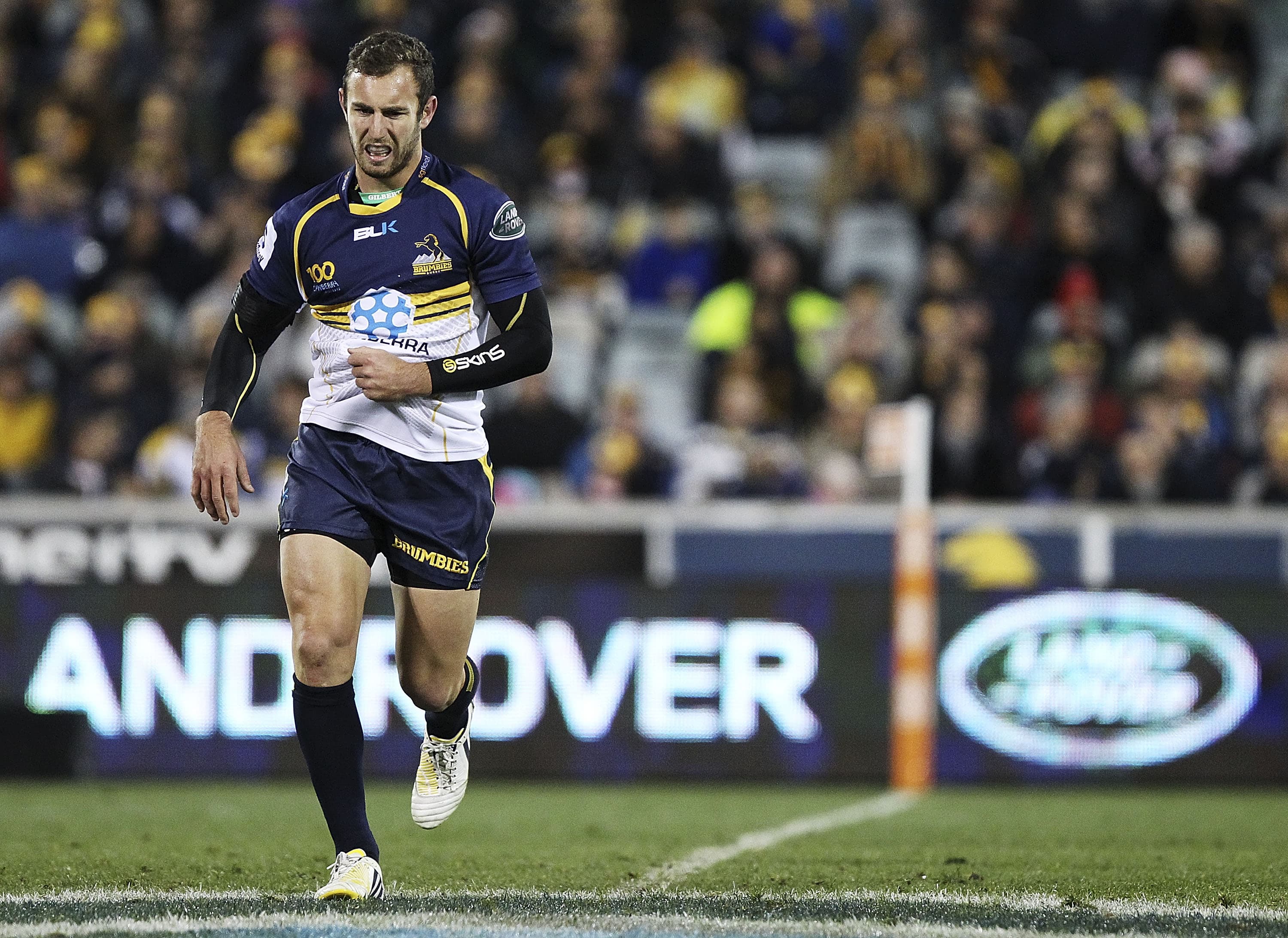 Nic White leaves the field after the shoulder injury that ended his Lions aspirations in 2013. Photo: Getty Images