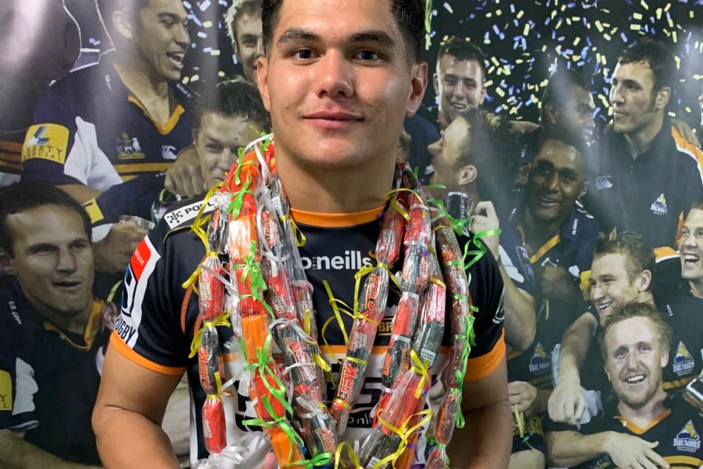 Noah Lolesio shows off the celebratory wreath given to him by family following his Super Rugby debut. Photo: RUGBY.com.au