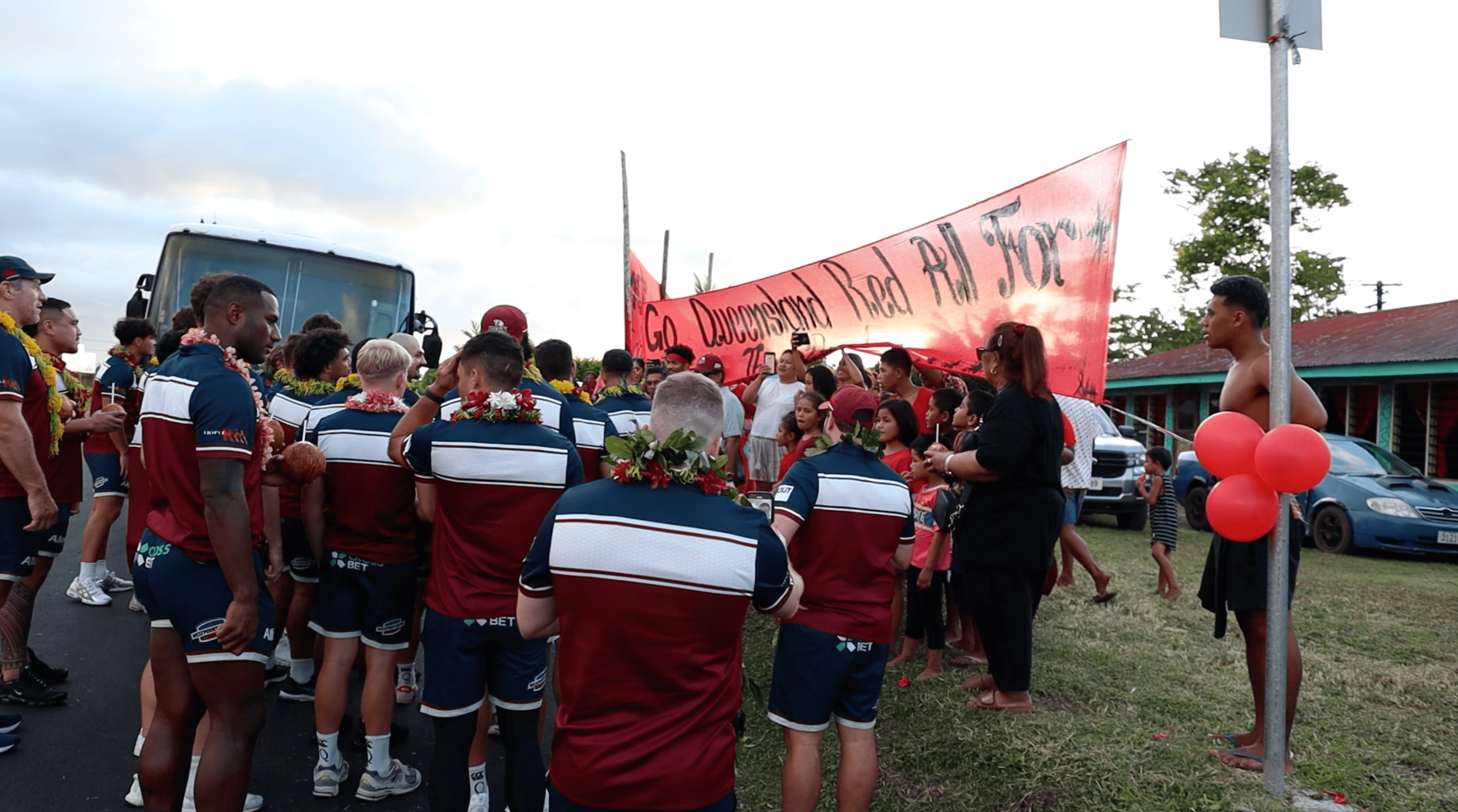 The Reds team stop at the village of hooker Richie Asiata in Samoa. Photo: Tom Primmer