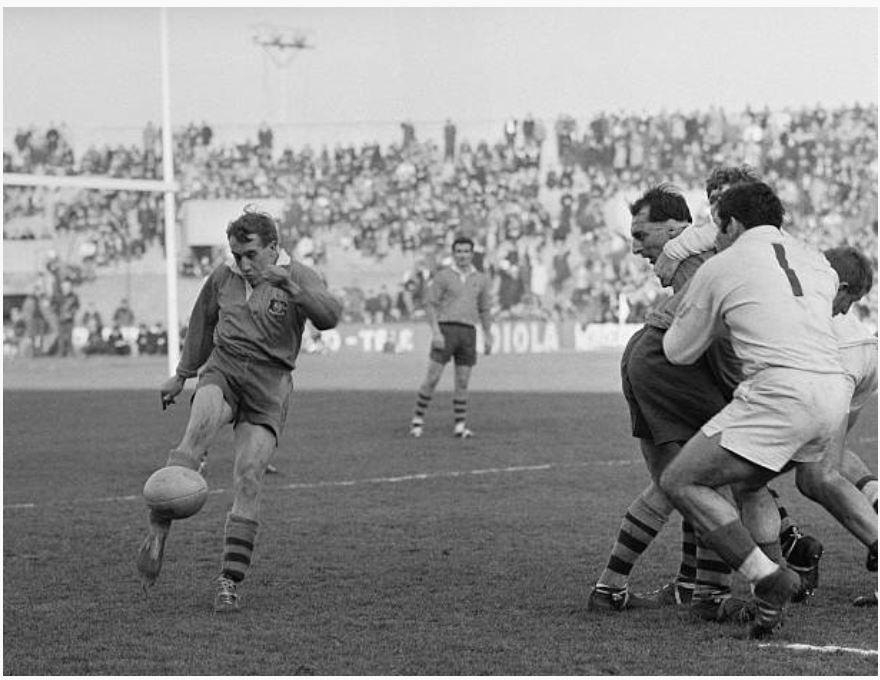 Action shot Ken Catchpole clears the ball watched by John Brass in background Australia v France Stade Colombes Paris