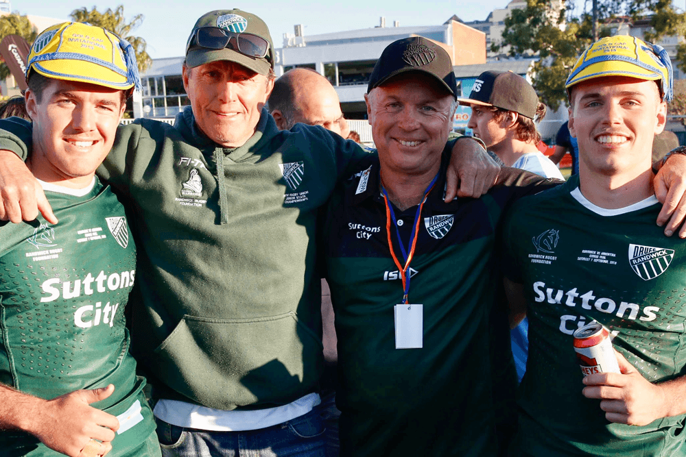 Will Harrison and Ben Donaldson with their fathers, Stu and Mark, after last year's clash with the Argentina test side. Photo: Supplied