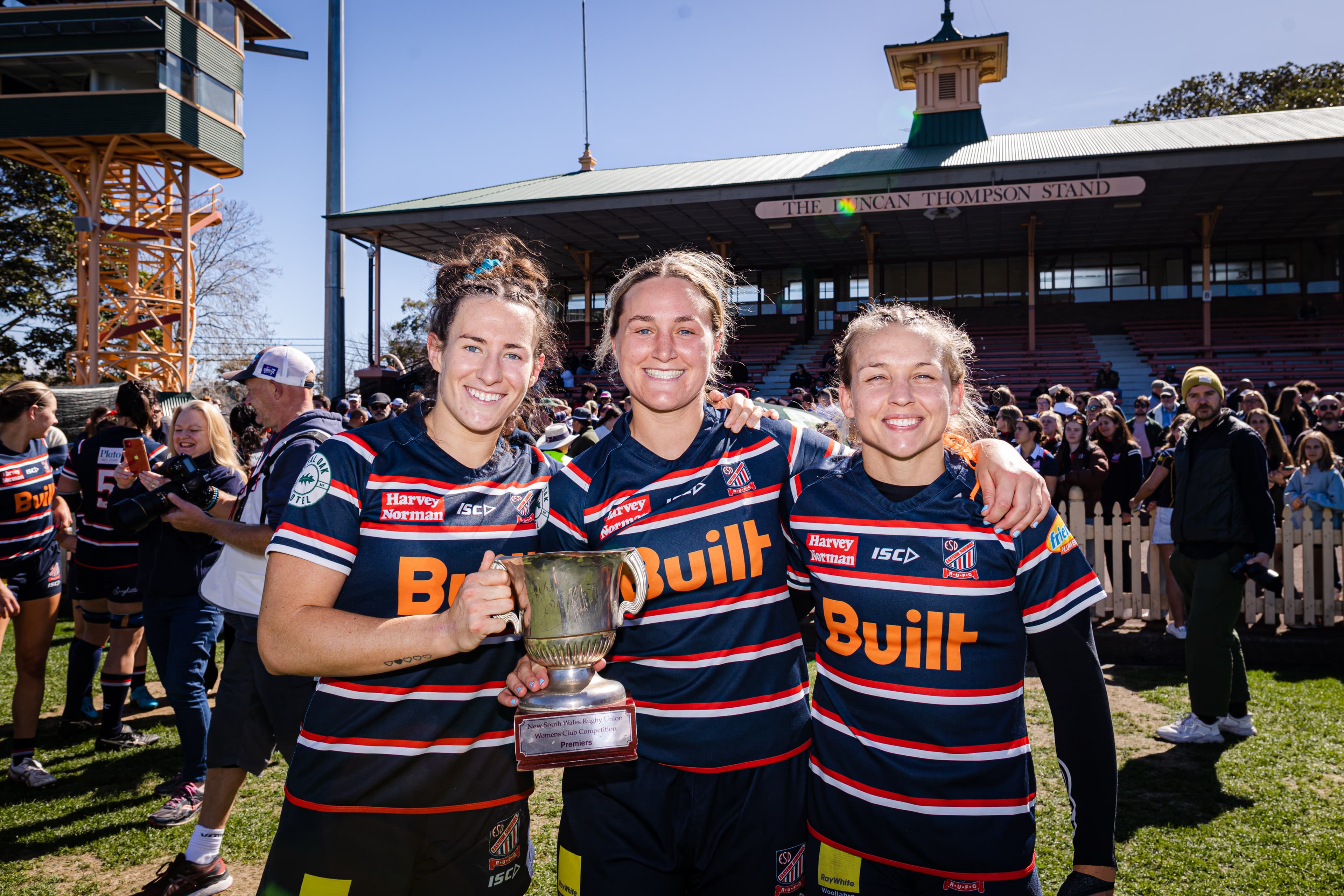 (L to R): Wallaroos Maya Stewart, Arabella McKenzie and Georgina Friedrichs celebrate their win for Easts over Uni