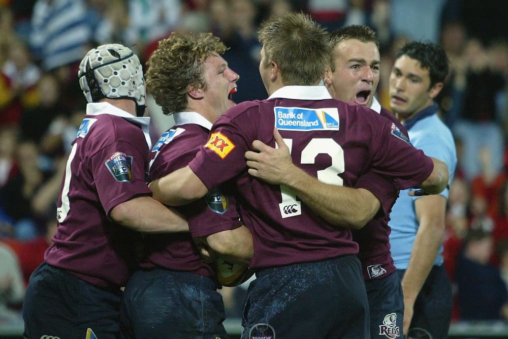 Chris Latham celebrating the Reds' win over the Waratahs in 2004. Photo: Getty Images