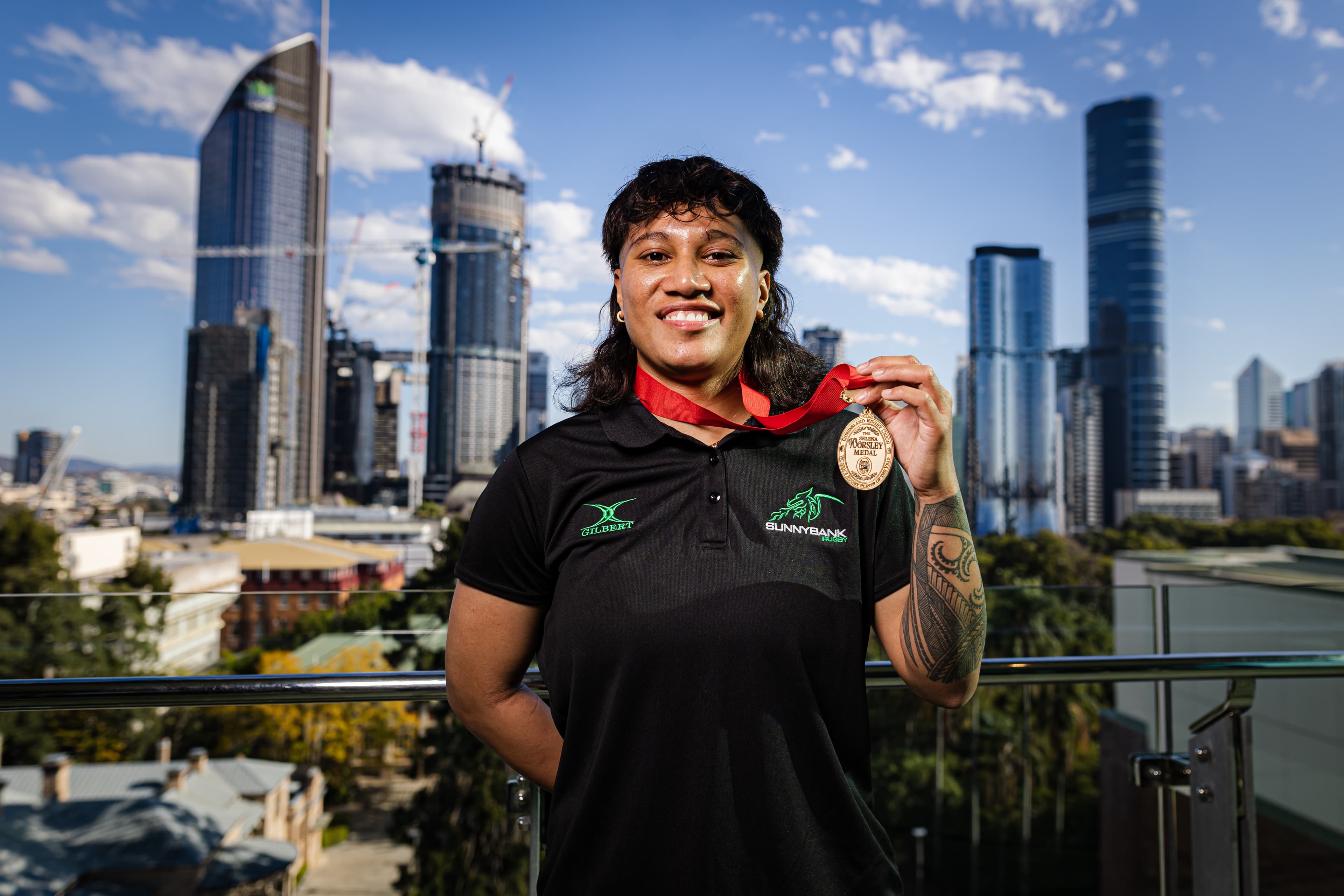 Ana Afuie with the Selena Worsley Medal as best club player. Photo: Brendan Hertel/QRU Media