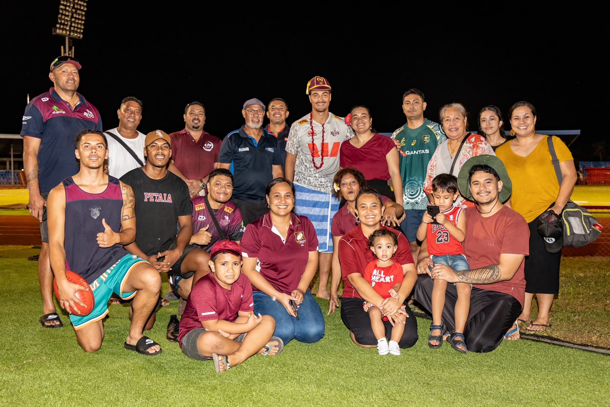 Jordan Petaia wearing his 50-game cap amongst his Samoa-based family in Apia. Photo: Tom Primmer