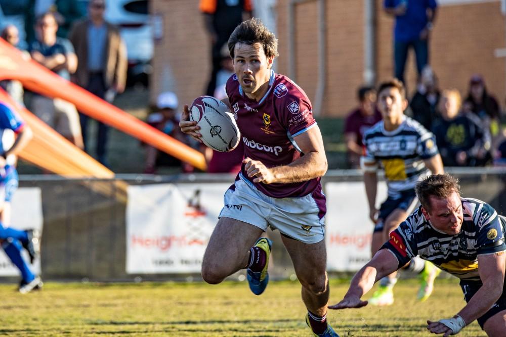 University flyhalf Scott Gale scoots into open space in the semi-final win over Brothers. Photo: Brendan Hertel, QRU