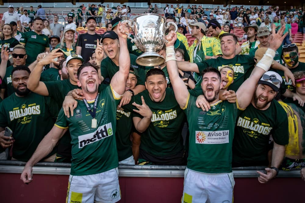 Harry Higgins (left) and Connor Anderson lift the Hospital Cup. Photo: Brendan Hertel, QRU