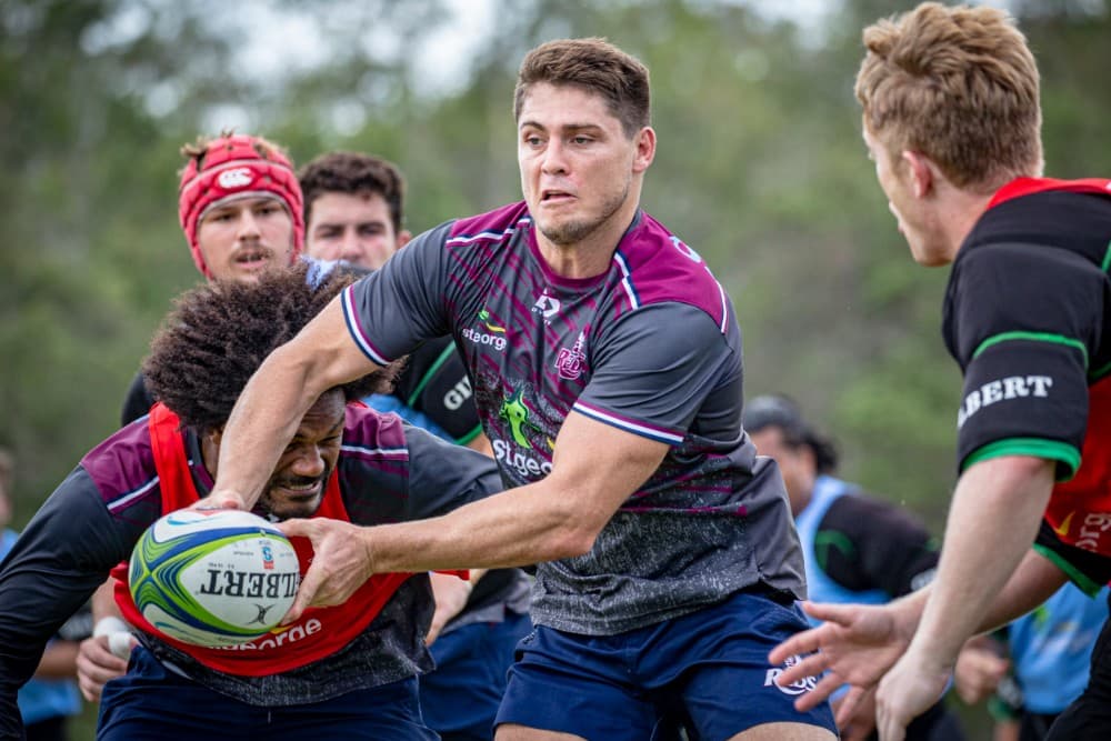 James O'Connor (ball) and Isaac Lucas (right) are set to combine to lead the Reds' backline in 2020. Photo: QRU Media/Brendan Hertel